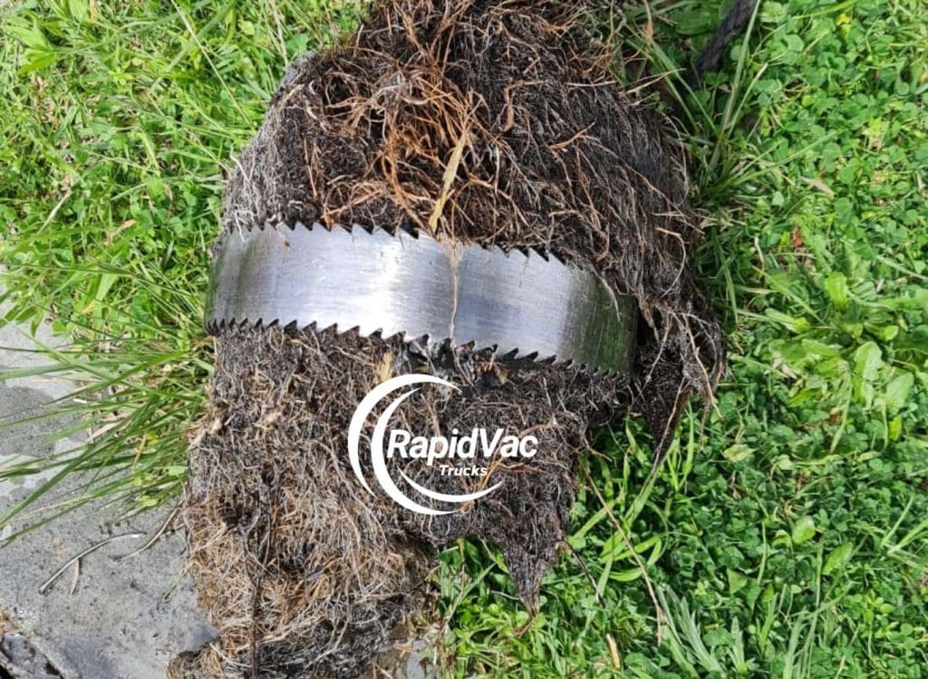 Vacuum truck removing tree roots causing drain blockages in Perth.